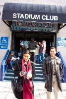 Sarita and Raj in front of the Stadium Club exclusive entrance
